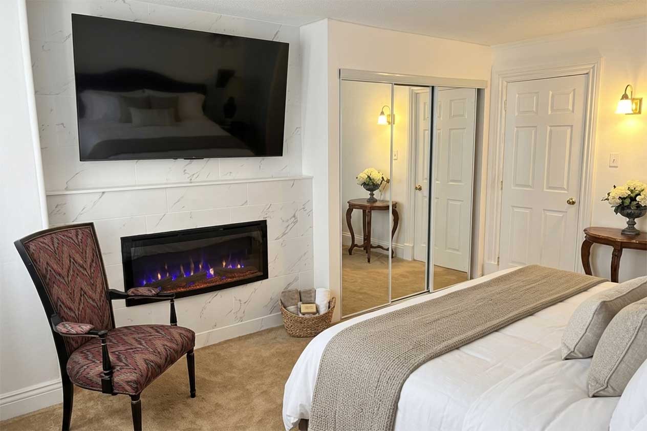 Historic King room - marble fireplace with 65 inch TV